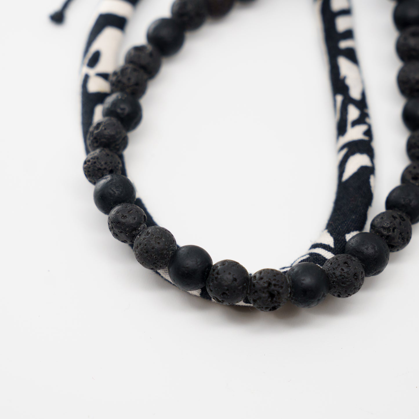 Noir beads stacked with a raven band.