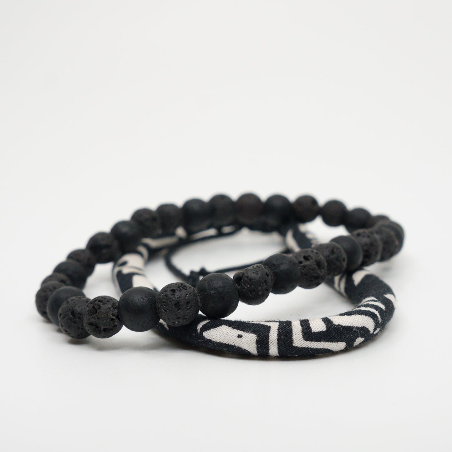 Noir beads stacked with a raven band.