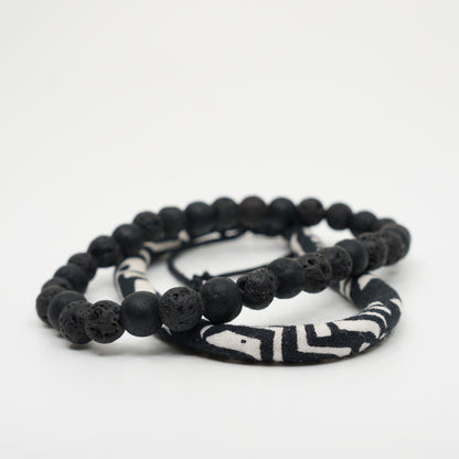 Noir beads stacked with a raven band.