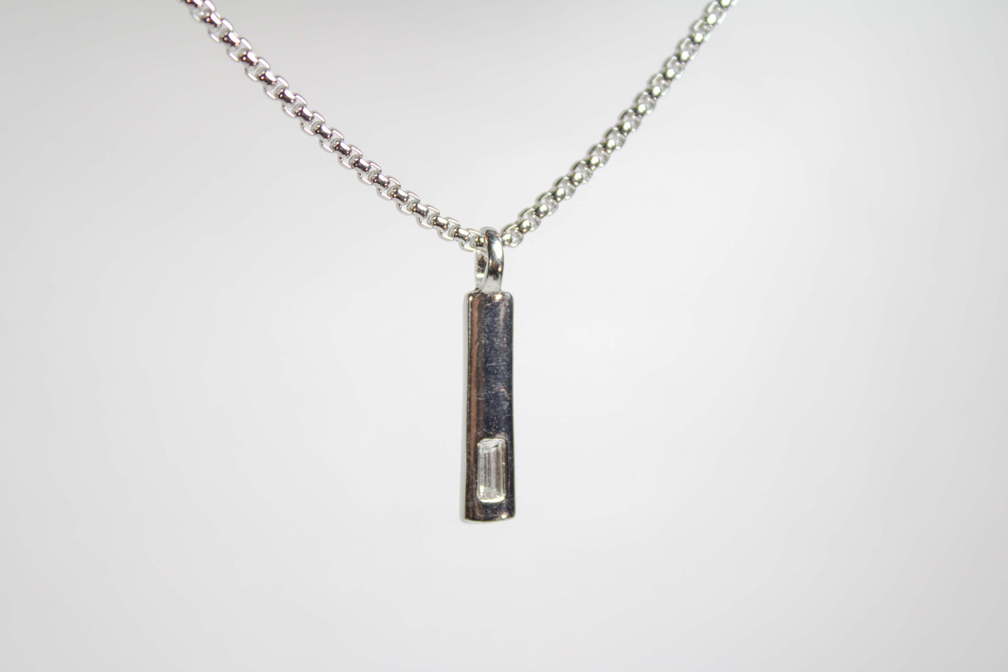 Baguette Bar layered Cuban chain necklace.