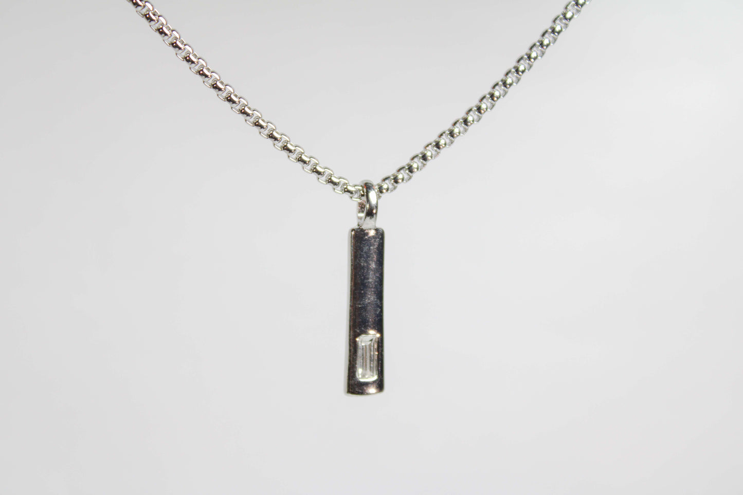 Baguette Bar layered Cuban chain necklace.