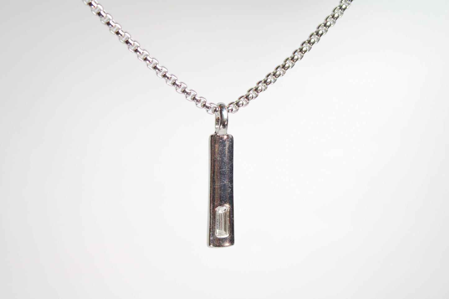 Baguette Bar layered Cuban chain necklace.